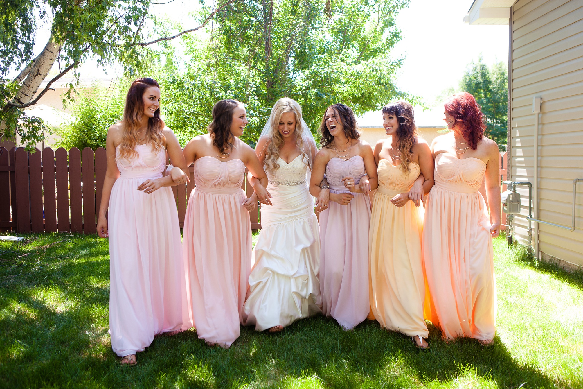 Bridesmaid dresses in shades of pink and coral, Kinsey Holt Photography