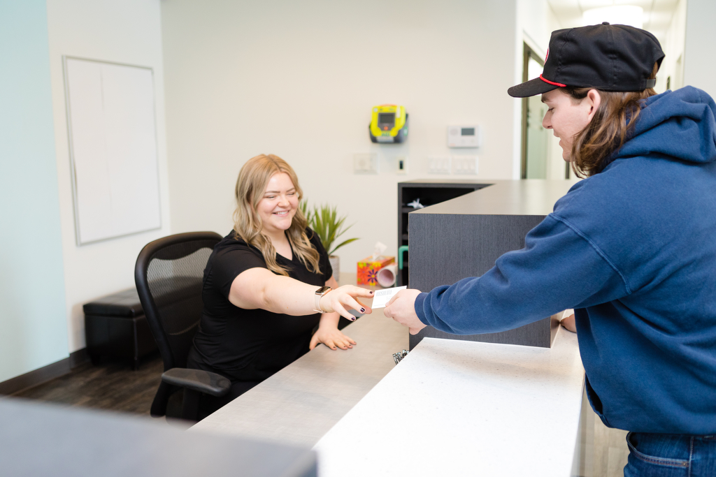 Absolute dental admin helping patient in Lethbridge dentist photography