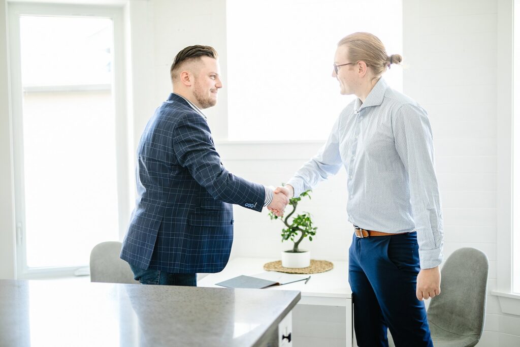 Realtor and client shaking hands