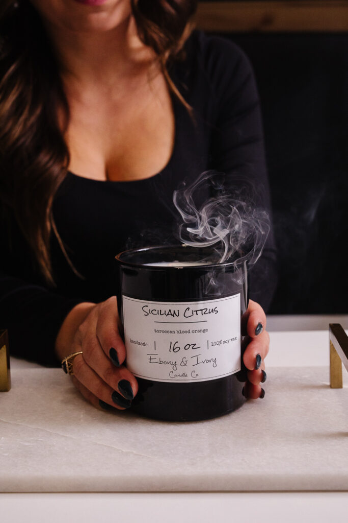 Smoke lifting from a candle, Lethbridge product photos by Kinsey Holt