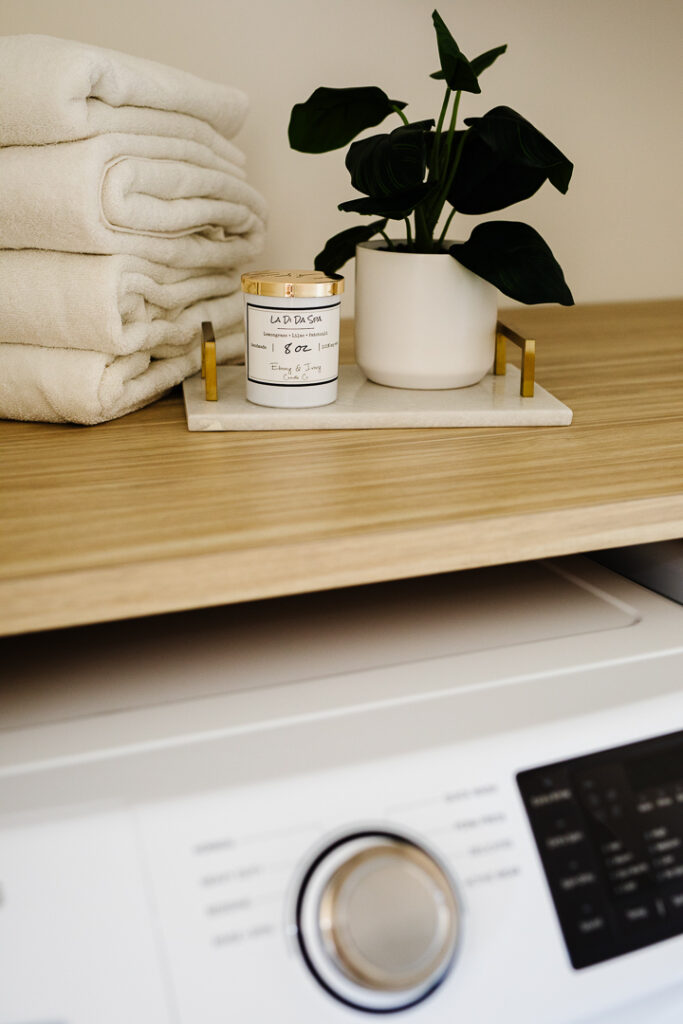 How to make your laundry room smell amazing - use a candle from Lethbridge candle maker Ebony & Ivory, Lethbridge product photos by Kinsey Holt Photography