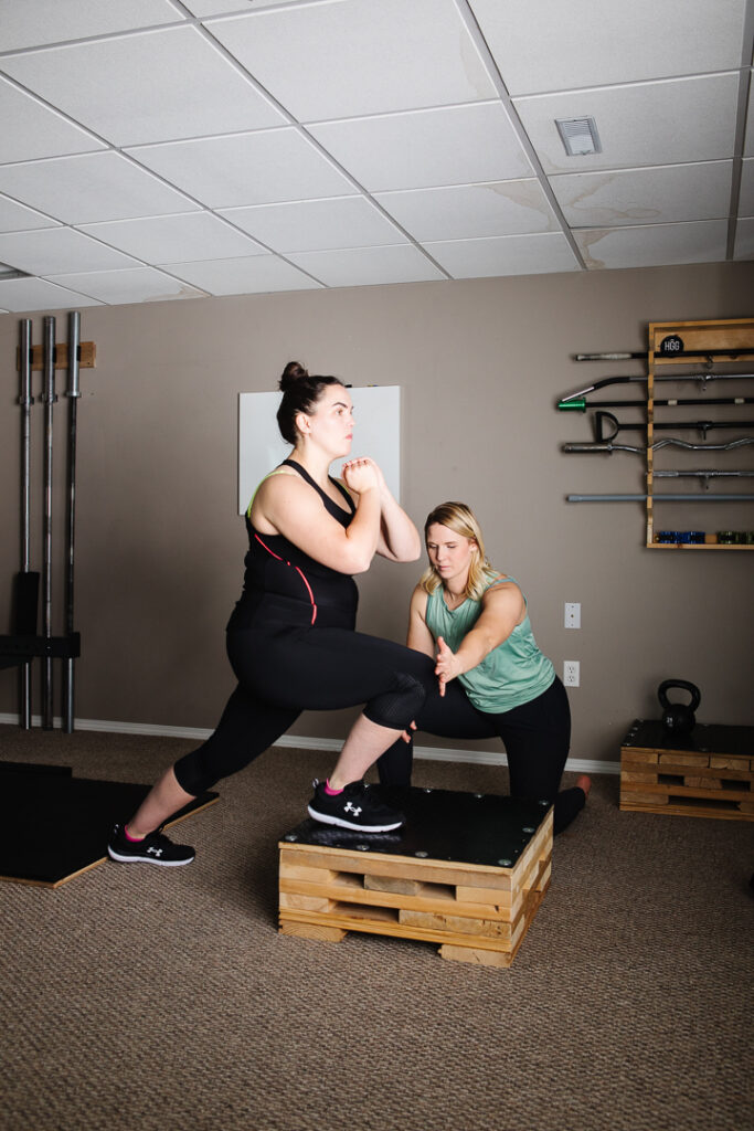 Health and talking with client in a photograph by Kinsey Holt, Lethbridge brand photographer